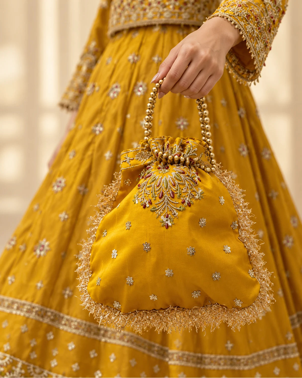 Mustard Golden Embroidered Bridal Lehenga Choli with Net Dupatta & Matching Potli Bag