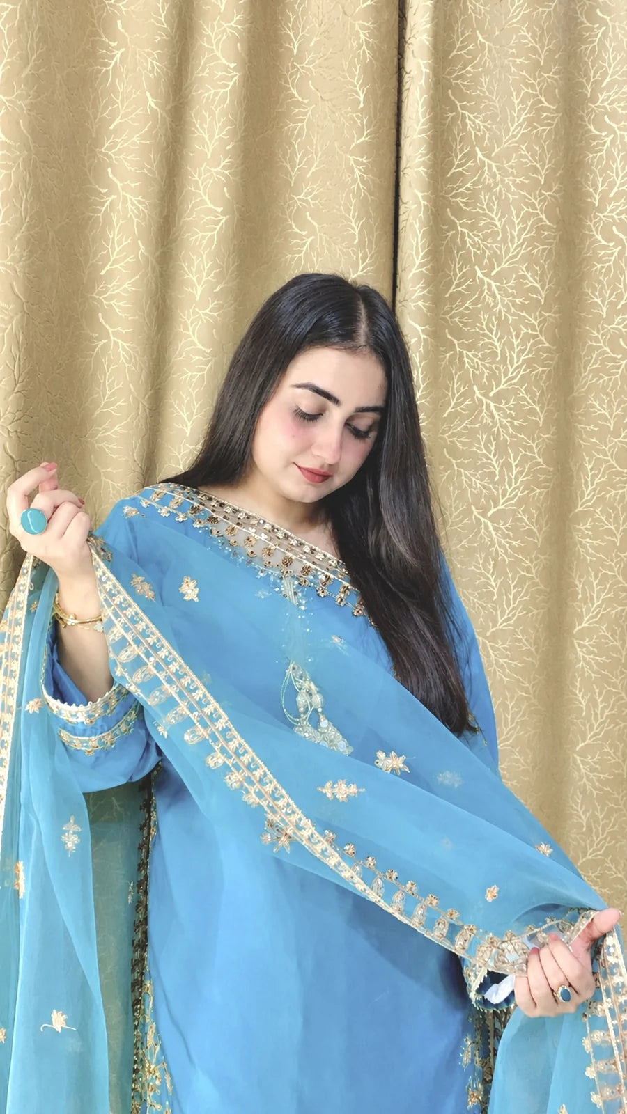 Sky blue Farshi Shalwar suit featuring a sheer organza dupatta with intricate golden embroidered borders.